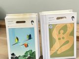 two boxes with pictures of birds on them on a table