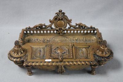 an image of a gold plated bench with a clock on it