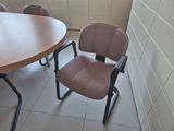 two chairs and a table in a small room