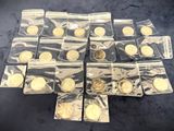 some of the gold coins are in plastic bags on a table