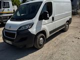 a white van that is parked in a parking lot