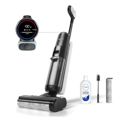 an image of a black and silver vacuum cleaner with a toothbrush and toothpaste