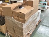 a large pile of boxes sitting on a pallet in a warehouse