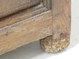a close up of a bed with a wooden frame