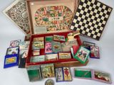 a wooden box filled with assorted cards and a chess board