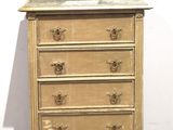 a small dresser with a mirror on top of it