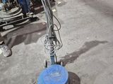a machine that is sitting on the ground in the garage