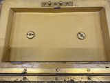 a small metal box with two buttons on it