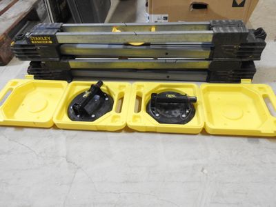 three yellow trays that are sitting on the floor