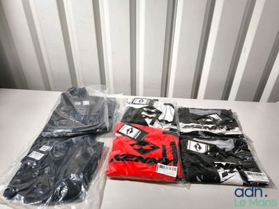 a lot of clothing that is sitting on a table