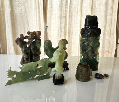 a lot of figurines sitting on a table next to each other