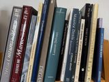 many books that are on a shelf in the room