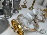 a lot of silver and gold items on the table