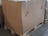 a large cardboard box sitting on a pallet in a warehouse