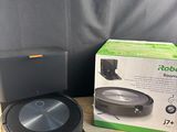 a close up of a box of a robot vacuum on a table