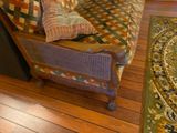 an image of a living room with a couch and a rug
