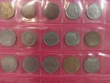 a lot of different coins in a plastic case
