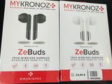 two boxes of ze buds ear buds sitting on top of a table