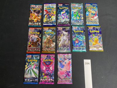 a lot of pokemon trading cards on the table