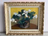 un tableau représentant une plante en pot posée sur une table
