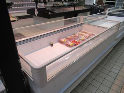 a refrigerated display case in a grocery store