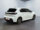the rear end of a white car in a white room