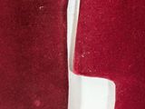 two pieces of red velvet are shown on a white surface