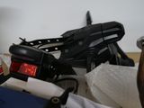a motorcycle that is sitting on the floor next to other items