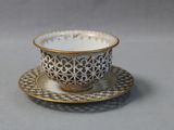 a cup and saucer on a saucer on a table
