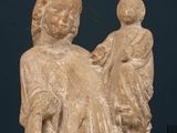 a statue of a woman holding a child in her arms