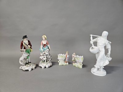 four figurines that are sitting on a table