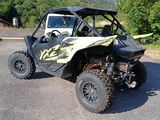 an image of a utv parked in a parking lot