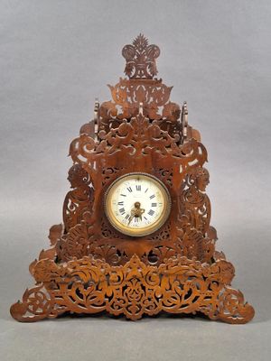 a wooden clock that is sitting on a table