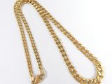 a gold chain with a clasp on a white background