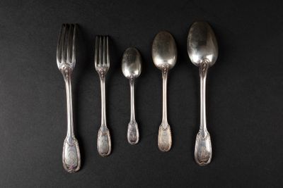 five silver spoons and a fork on a black surface