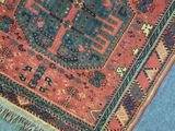a cat sitting on top of a rug on the floor