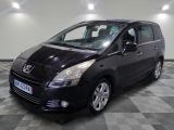 a picture of a small black car parked in a garage