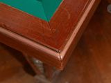 a close up of a table with a green cloth on it