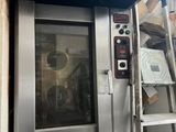 an image of a commercial oven being installed in a building