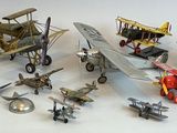 a lot of toy airplanes that are sitting on a table