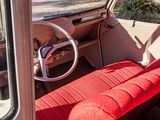 a red seat in the back of an old car