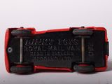 a close up of a red and black toy car