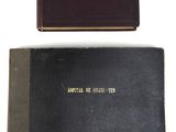 two books sitting on top of each other on a white surface