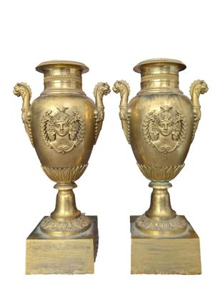 two vases that are sitting on top of each other