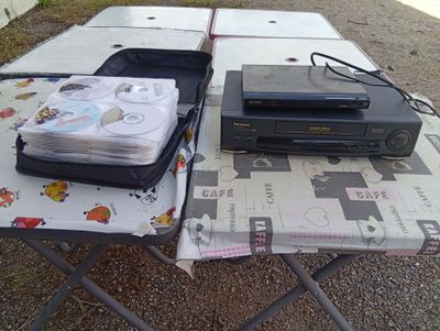 a table that has a television and other items on it