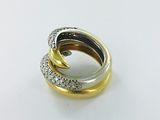 an image of a gold and silver ring on a white surface