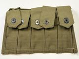 une image montrant un gros plan d'une ceinture ornée de boutons