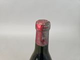 a bottle of wine that is sitting on a table