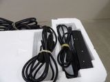 two cords and a charger in a white box