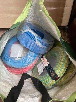 a bag full of different colored wires in it